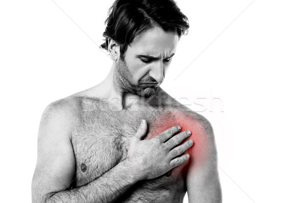 Young man having chest pain Stock photo © stockyimages