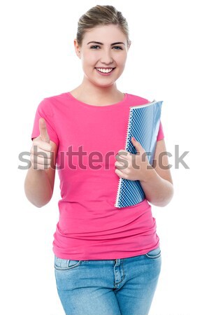 Attractive girl showing thumbs up Stock photo © stockyimages