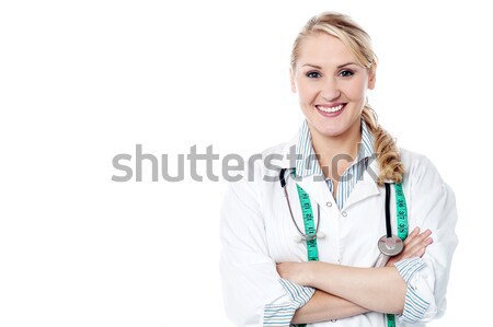 Female surgeon posing with a radiant smile Stock photo © stockyimages