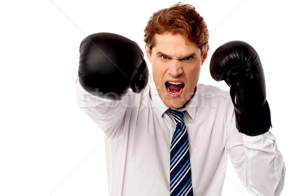 Angry corporate guy in action Stock photo © stockyimages