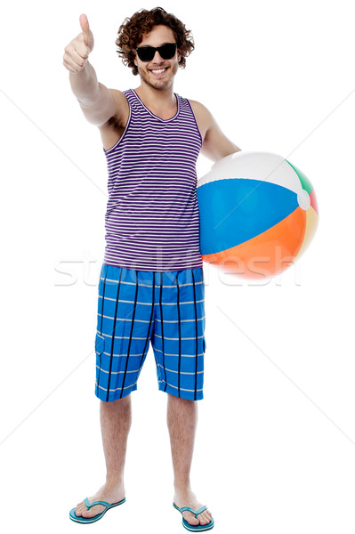 Vrolijk vent gebaar jonge man strandbal Stockfoto © stockyimages