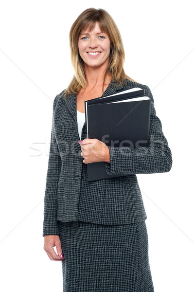 Happy businesswoman ready to attend meeting Stock photo © stockyimages
