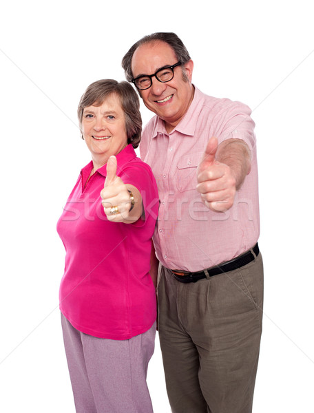 Senior couple gesturing thumbs up Stock photo © stockyimages