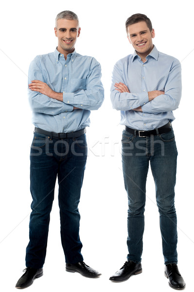 Casual young smiling men posing Stock photo © stockyimages