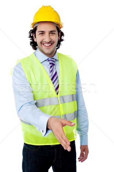 Architect holds out his hand for a handshake Stock photo © stockyimages