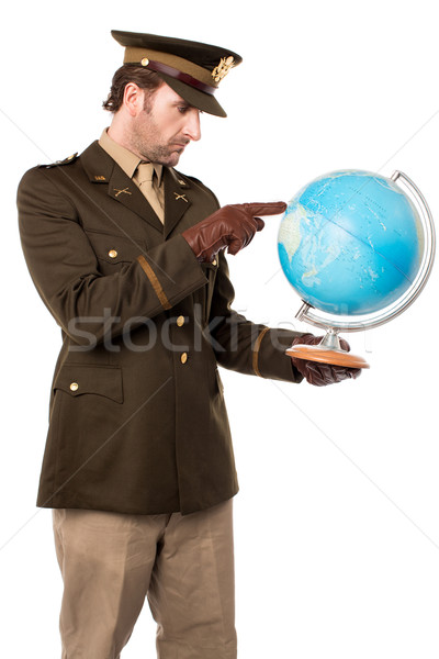 Military officer pointing the globe Stock photo © stockyimages