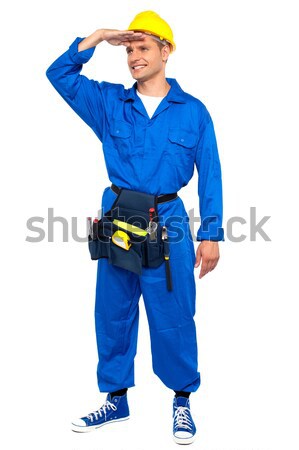 Repairman looking forward shielding hand Stock photo © stockyimages