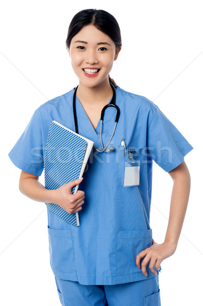 Female doctor holding patients records Stock photo © stockyimages