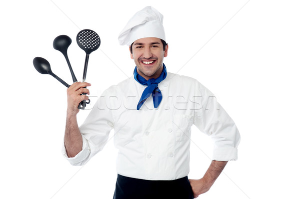 Chef showing kitchen essentials Stock photo © stockyimages