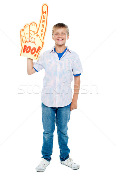 Young boy wearing a large foam hand Stock photo © stockyimages