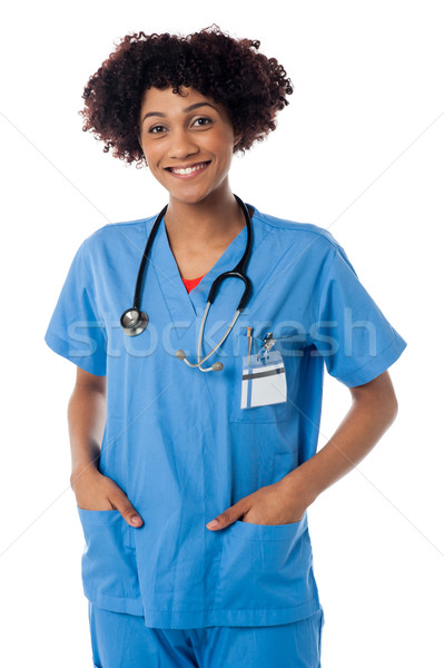 дружественный женщины врач улыбаясь изолированный белый Сток-фото © stockyimages