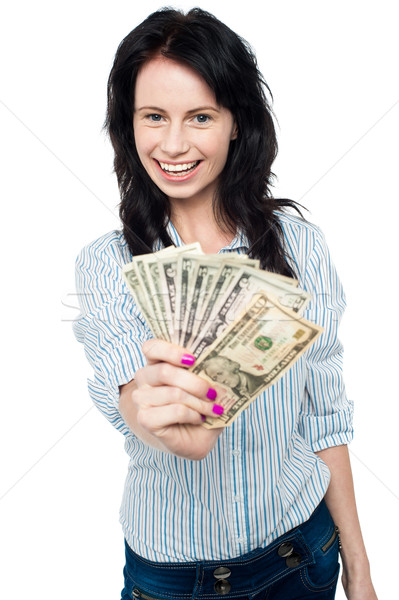 Stock photo: Young woman with dollars in her hands