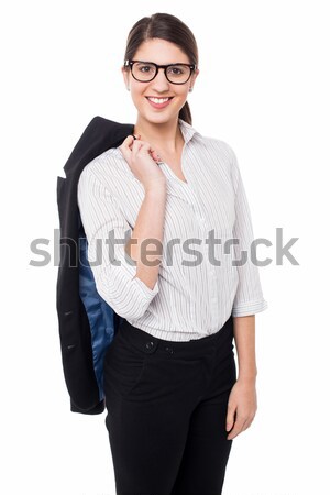 Corporate lady with blazer slung over her shoulder Stock photo © stockyimages
