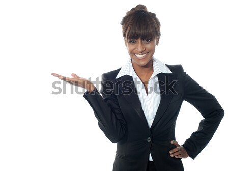 Female executive exposing copyspace area Stock photo © stockyimages