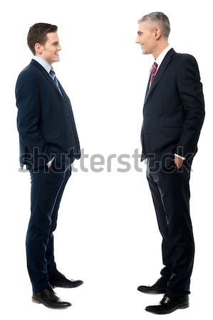 Rear-view image of two businessmen Stock photo © stockyimages