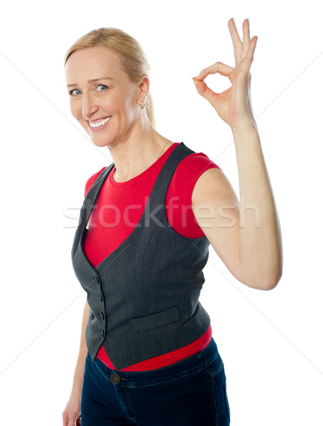Confident pretty woman gesturing excellent Stock photo © stockyimages