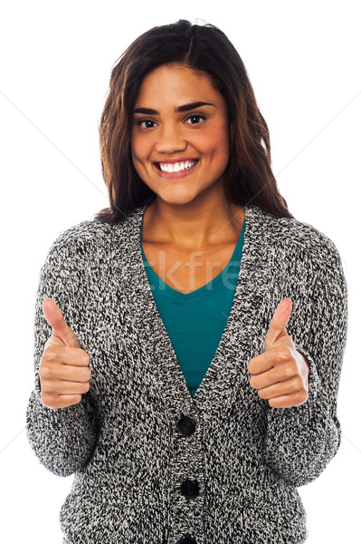 Attractive girl showing double thumbs up Stock photo © stockyimages