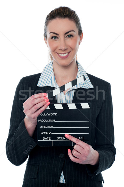 Pretty business lady with clapperboard Stock photo © stockyimages