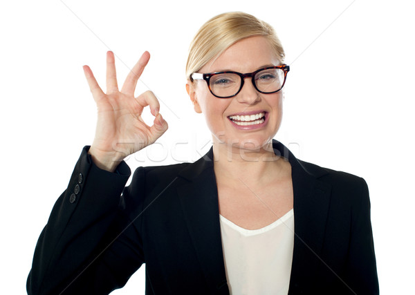 Successful business woman posing with ok sign Stock photo © stockyimages