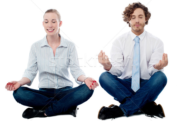 Business people practicing meditation Stock photo © stockyimages