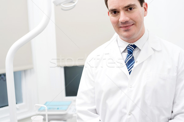 Dentist in his modern clinic. Stock photo © stockyimages
