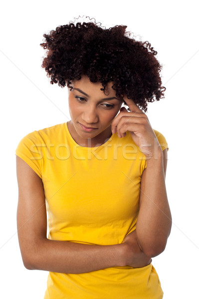 Calm and thoughtful curly haired young woman Stock photo © stockyimages