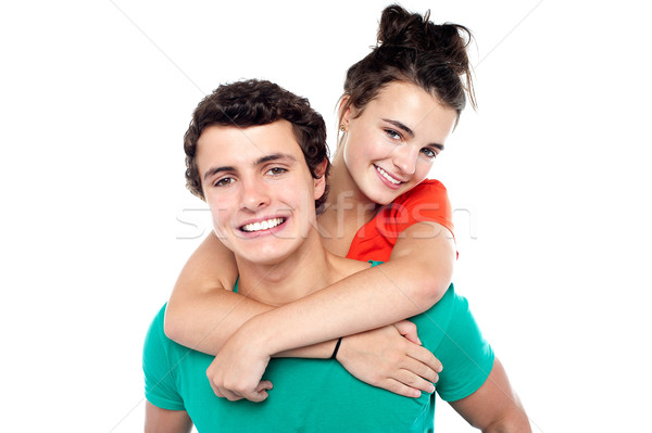 Young boy giving his girlfriend piggyback ride Stock photo © stockyimages