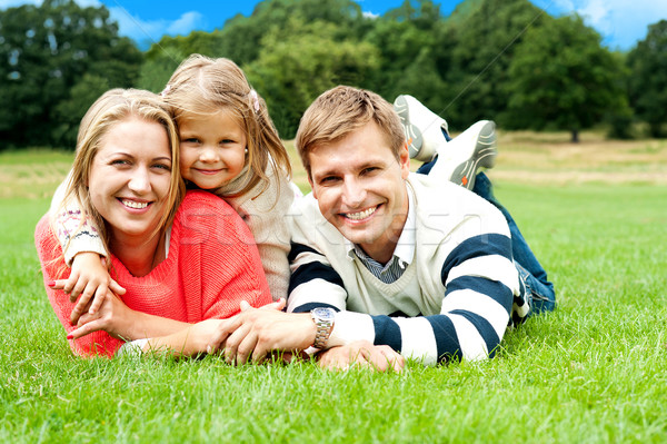 Joyous family in a park enjoying day out Stock photo © stockyimages