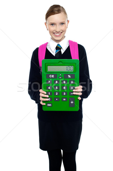 Iskolás lány tart nagy zöld számológép okos Stock fotó © stockyimages