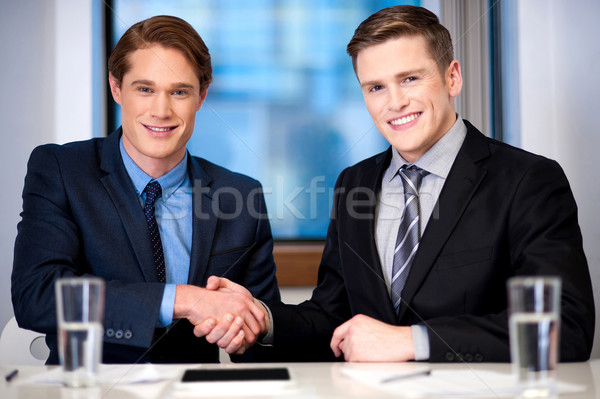 Corporate guys shaking hands Stock photo © stockyimages