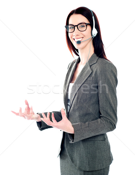 Smiling telemarketing girl posing in headsets Stock photo © stockyimages