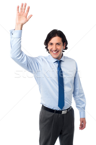Businessman waving hi to his colleague Stock photo © stockyimages
