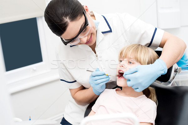 Little girl at dental clinic. Stock photo © stockyimages
