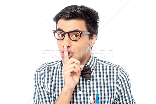 Silencio gesto guapo joven dedo labios Foto stock © stockyimages