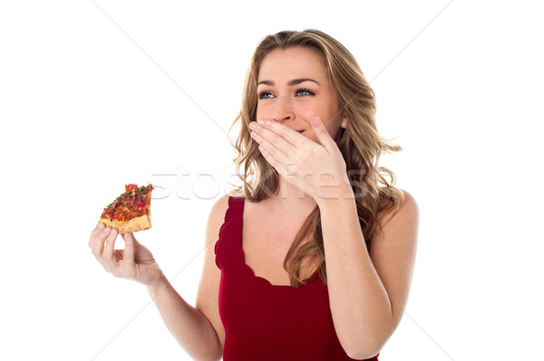 Csinos lány élvezi nyami pizza szelet gyönyörű lány Stock fotó © stockyimages