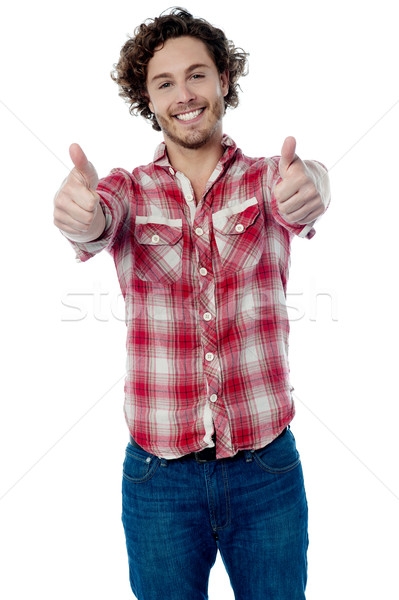 Guy showing double thumbs up Stock photo © stockyimages
