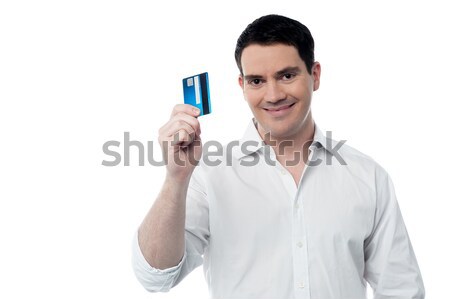Male executive showing his cash card Stock photo © stockyimages