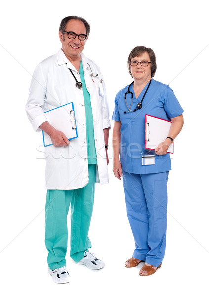 Kıdemli erkek doktor poz kadın hemşire tam uzunlukta Stok fotoğraf © stockyimages