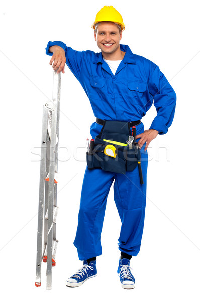 Stock photo: Industrial contractor resting hand on stepladder