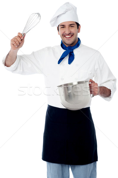 Smiling chef showing kitchen essentials Stock photo © stockyimages