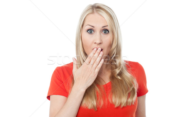 Shocked young woman over white Stock photo © stockyimages