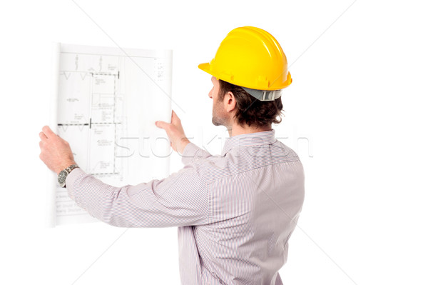 Architect reviewing building plan Stock photo © stockyimages