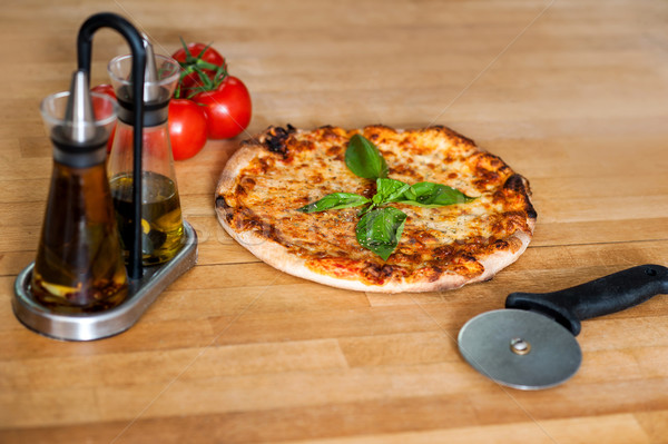 Pizza is ready, please help yourself. Stock photo © stockyimages