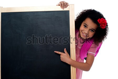 Csinos lány ül kréta tábla izgatott Stock fotó © stockyimages