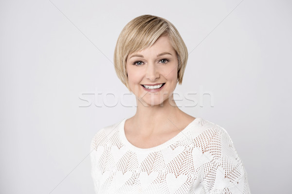 Casual pose of smiling middle aged woman Stock photo © stockyimages