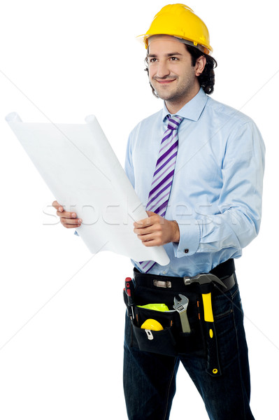 Male architect with construction plan Stock photo © stockyimages