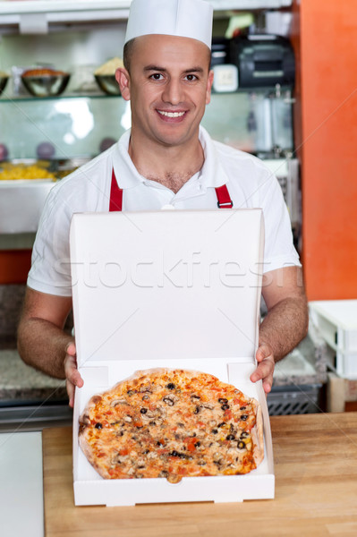 Here is your custom pizza sir.. Stock photo © stockyimages