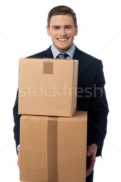 Young man posing with cardboard boxes Stock photo © stockyimages