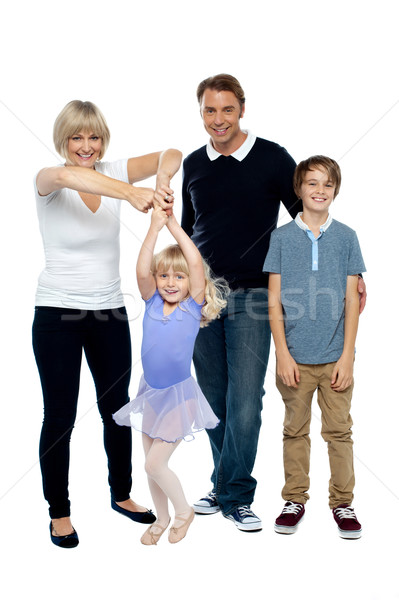 Mother helping her little ballerina twirl. Family beside Stock photo © stockyimages