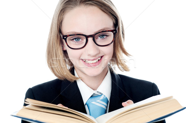Young business leader reading a book Stock photo © stockyimages